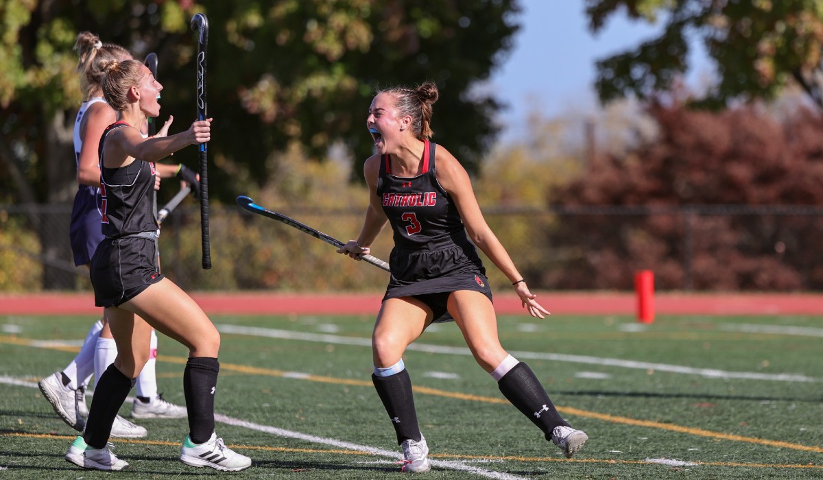 Mary is playing field hockey.