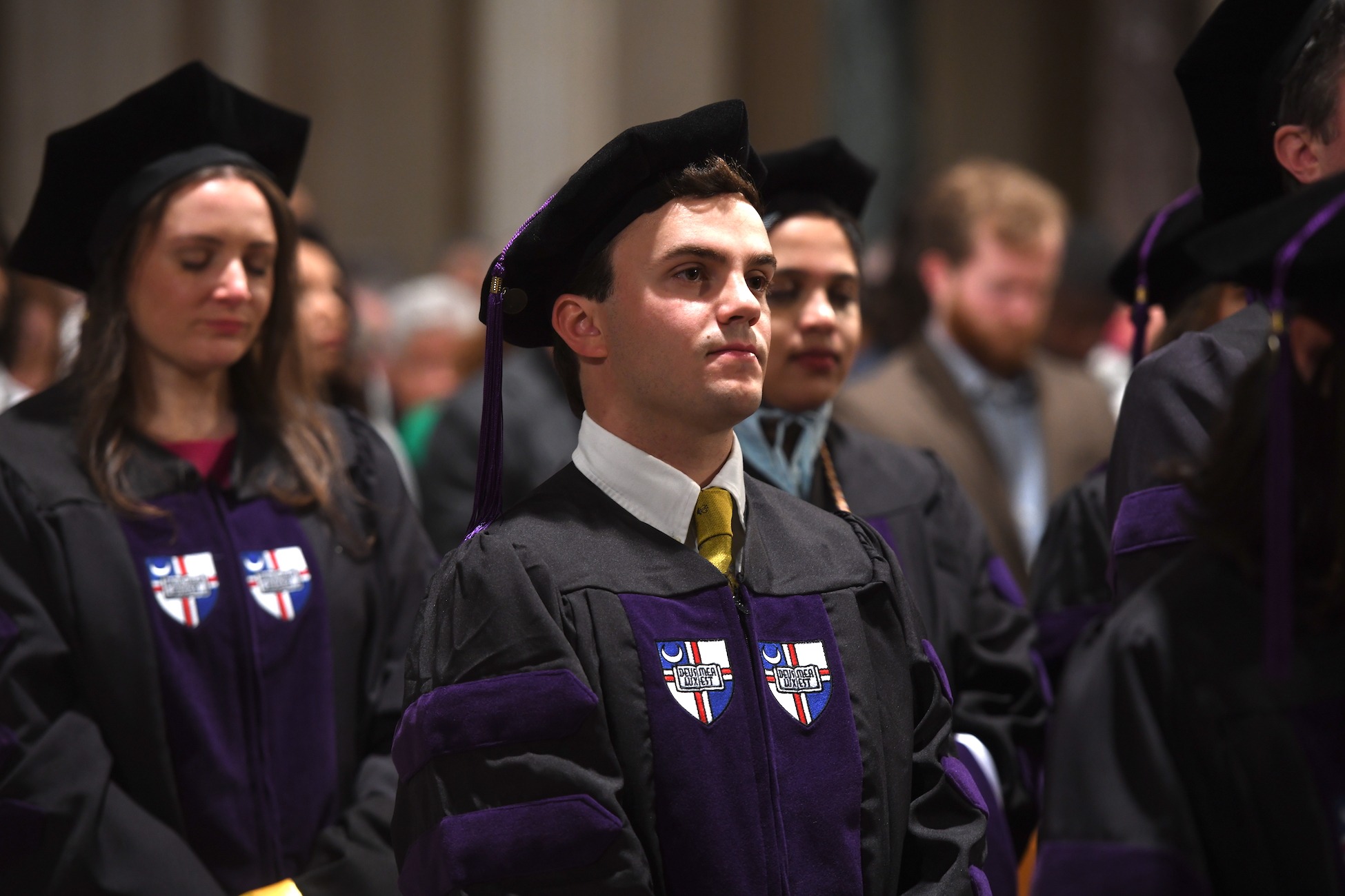 student dressed in his law school cap and gown at graduation