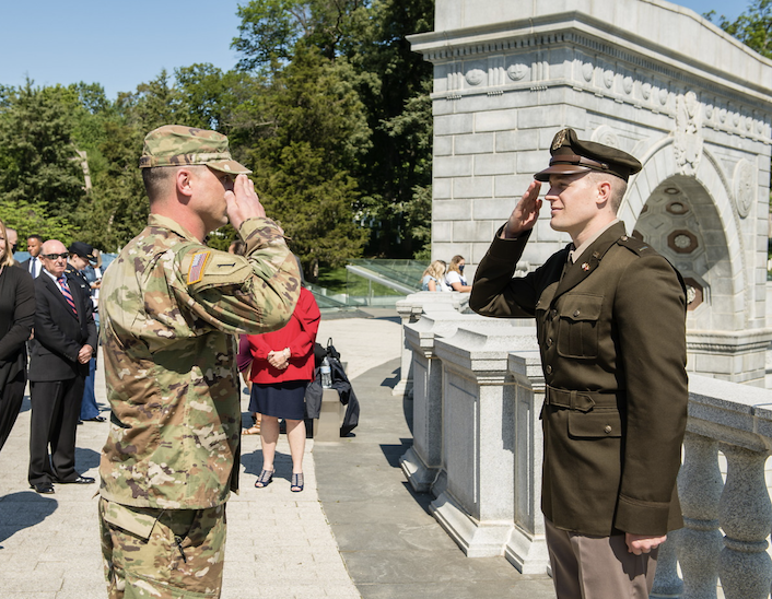 two gentlemen doing a military salute