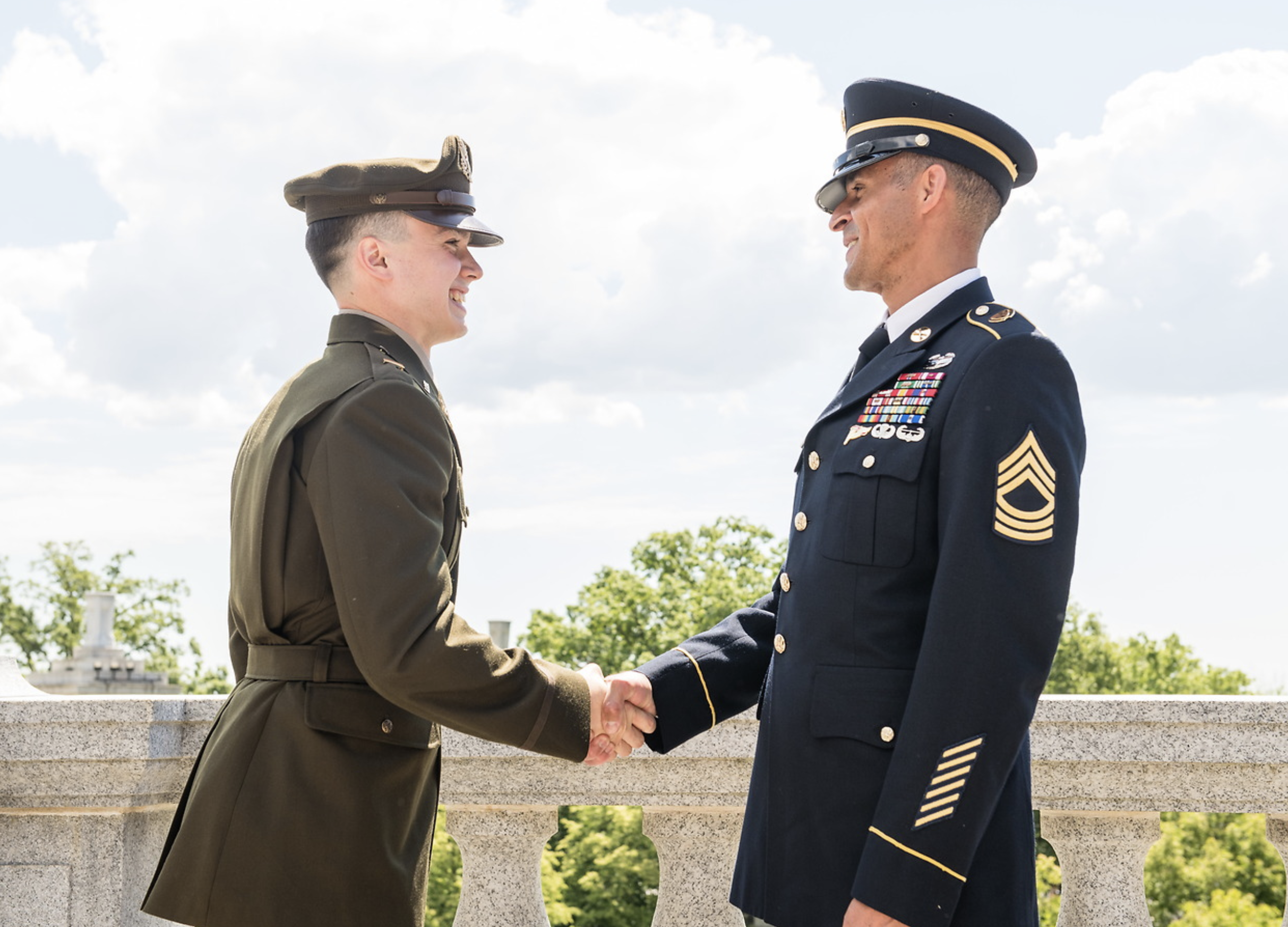 smiling military guys shaking hands