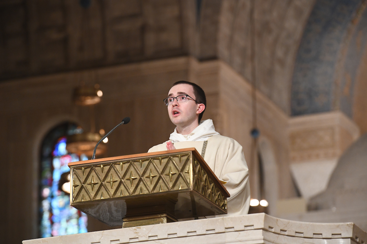 A priest celebrates the annual Mass of St. Thomas Aquinas.