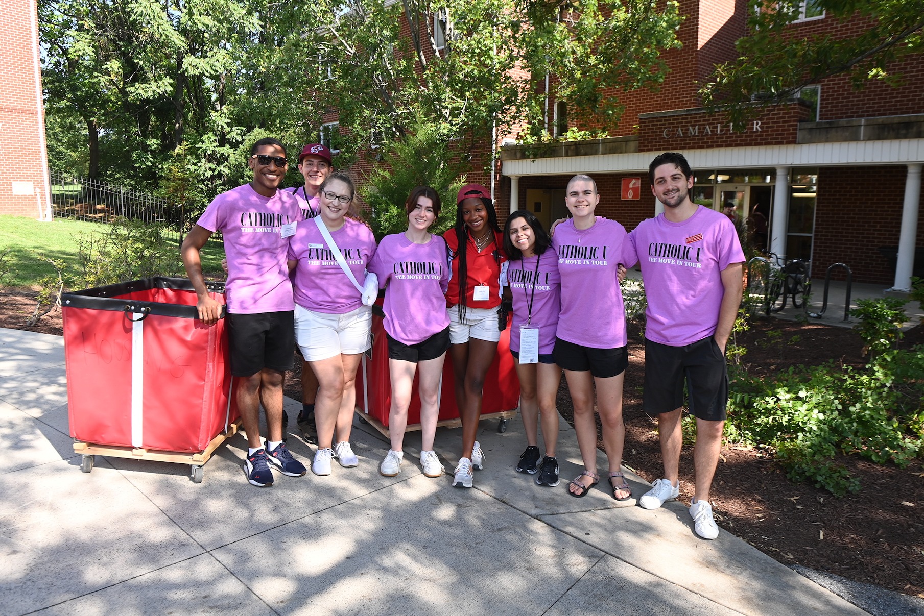 students helping during move in day at catholic university