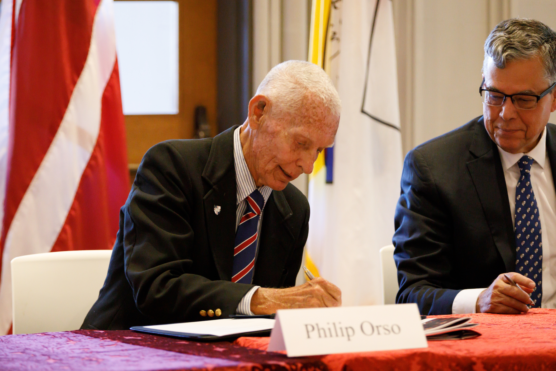 Philip Orso signing gift to Catholic University