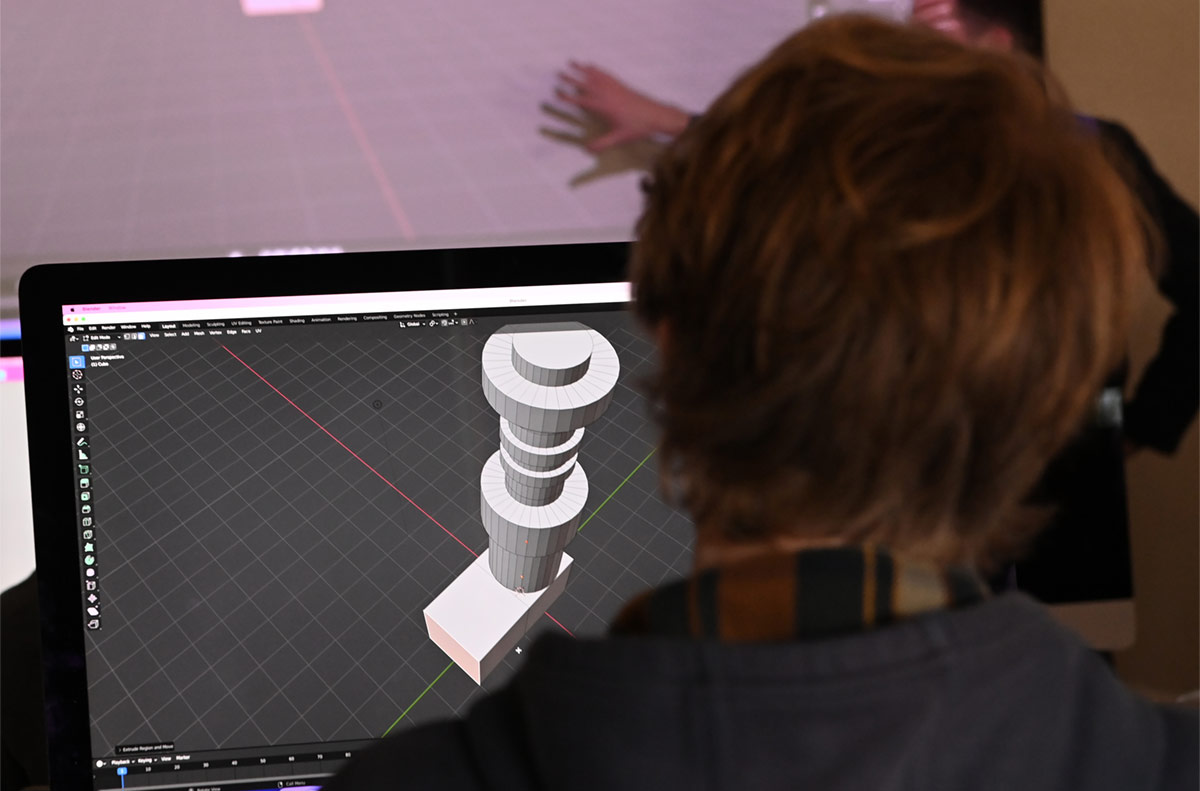 close up angle of a student working on a 3D modeling animation in class