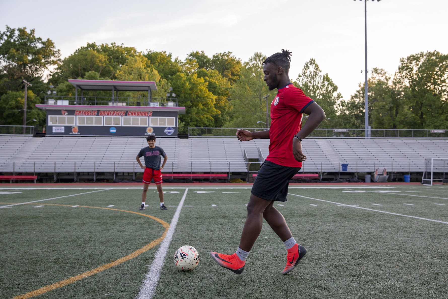 2 players practicing on soccer field