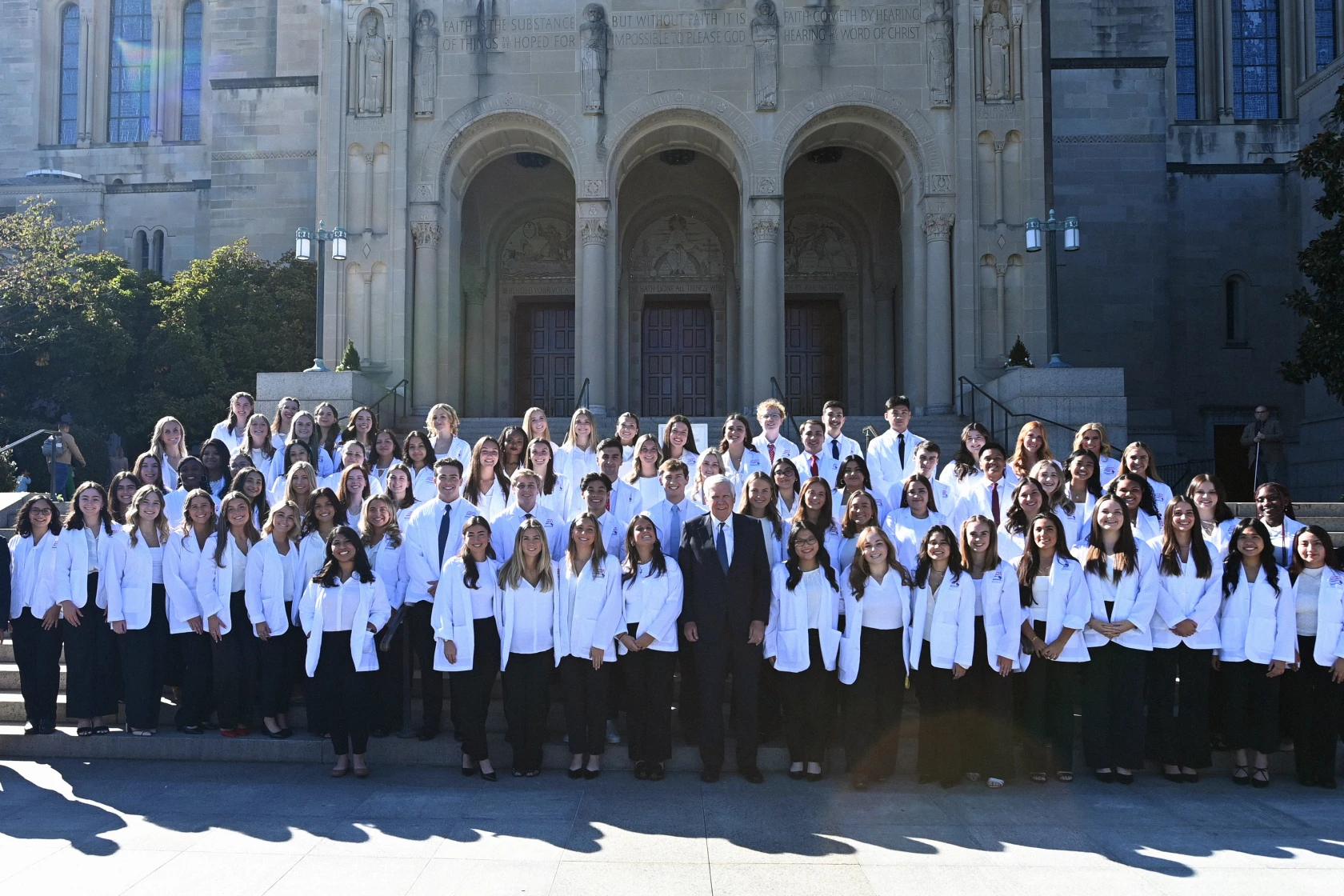 Bill Conway stands with a class of Catholic University Nursing students.