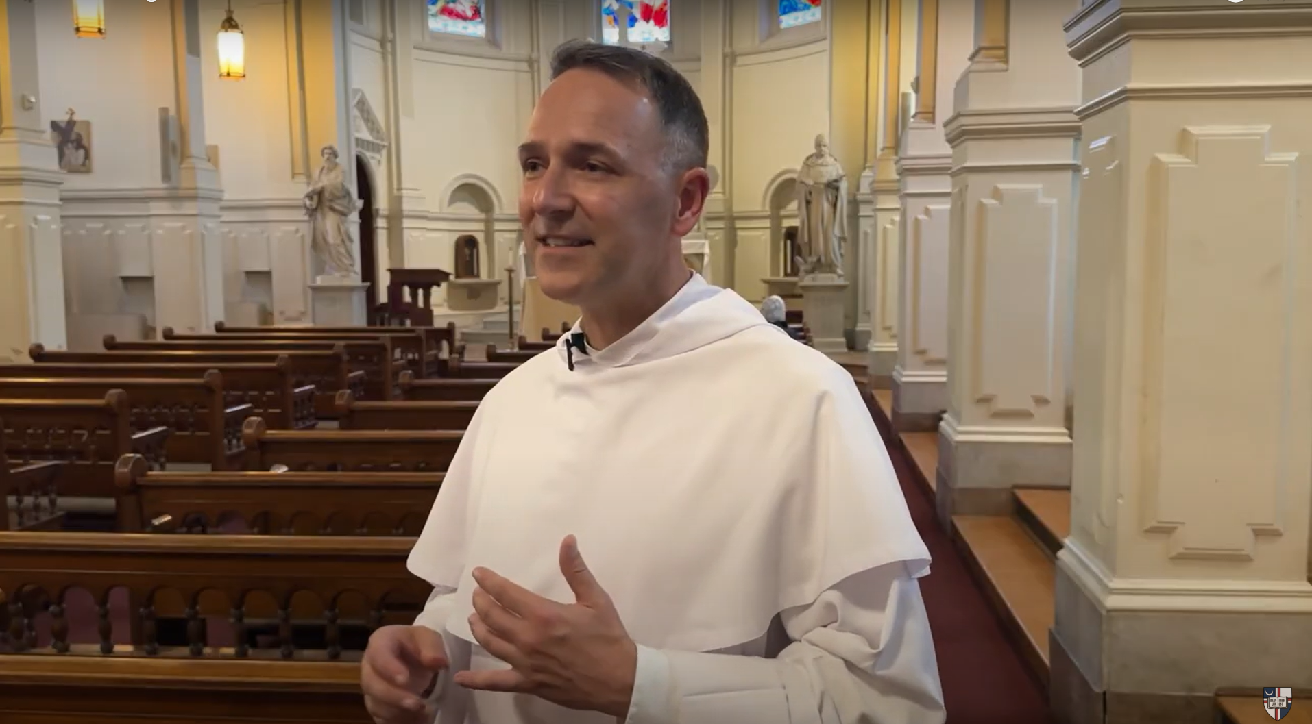 Father Aquinas speaks in Caldwell Chapel