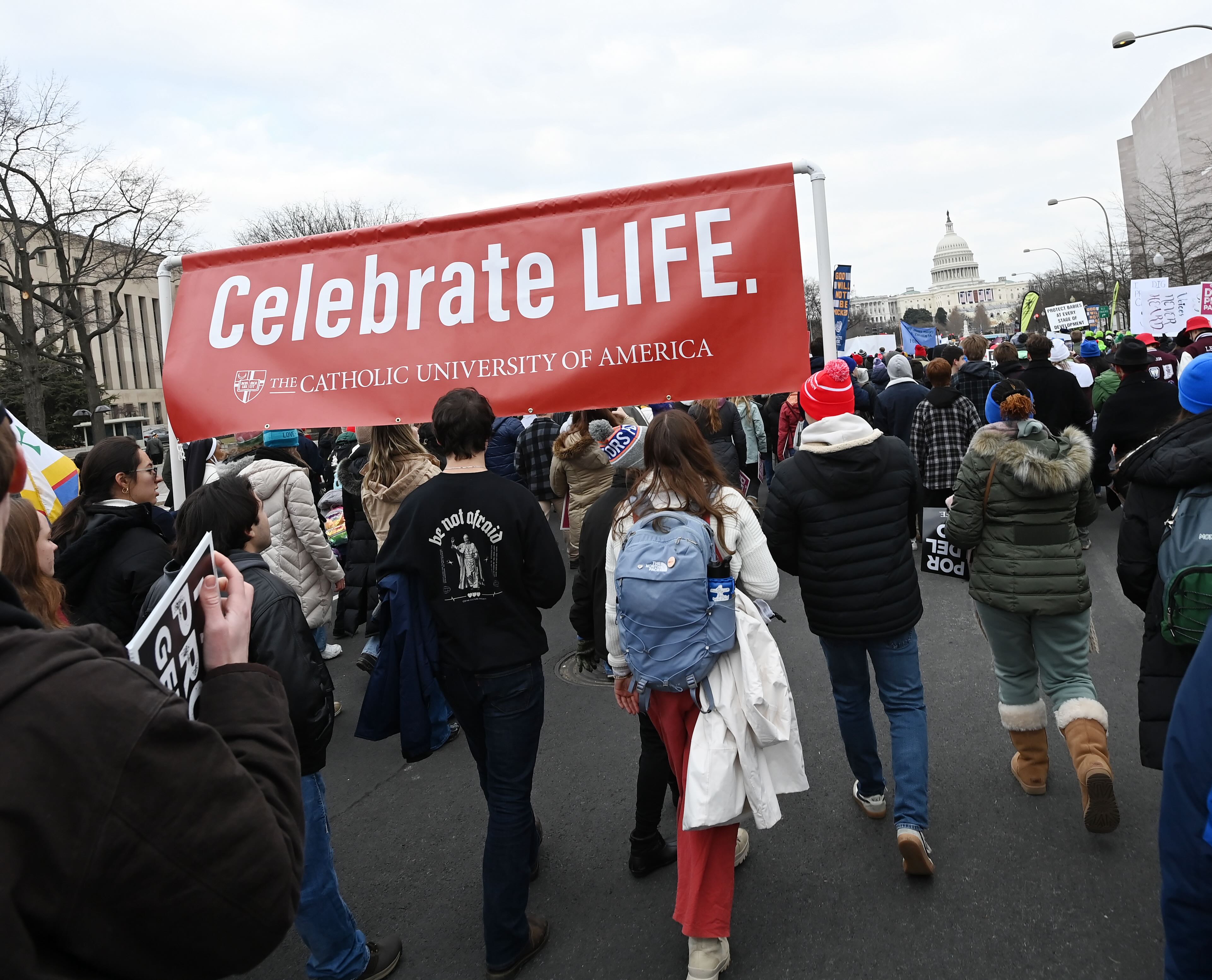 Catholic University students carry a Celebrate Life banner in the 2025 March for Life