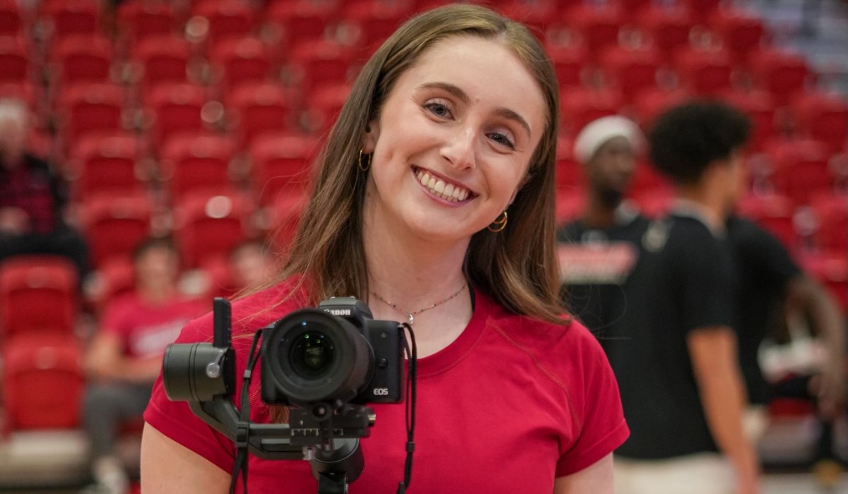 Kathryn Phillips is ready with her camera at the court side of DuFour.