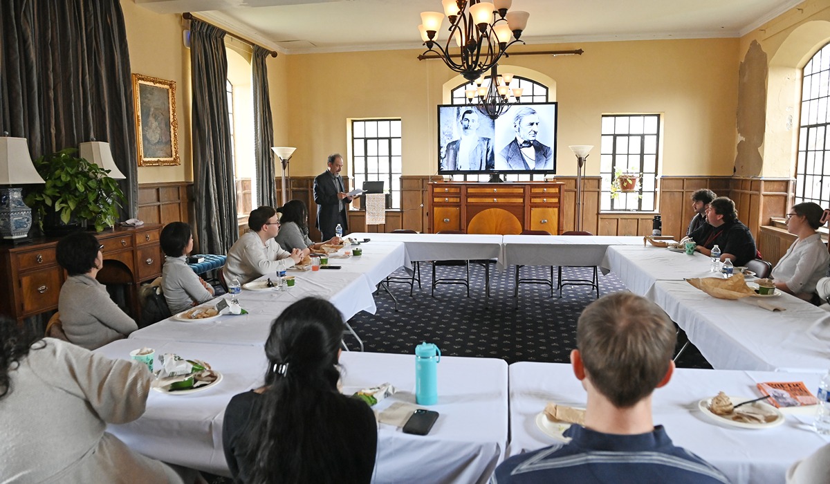 Ernest Suarez, Chair of the English department, speaks at a January Africana Studies Colloquium in Curley Hall. 