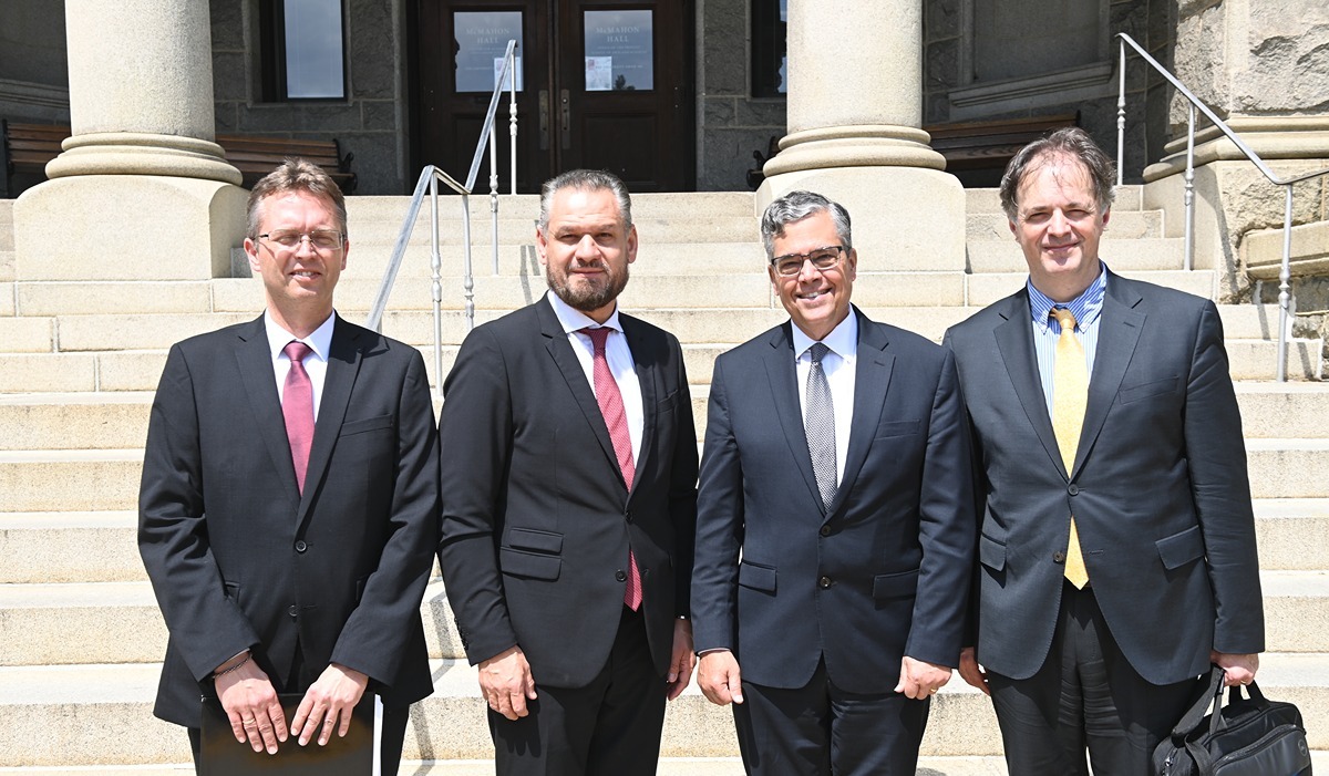 Four people standing together