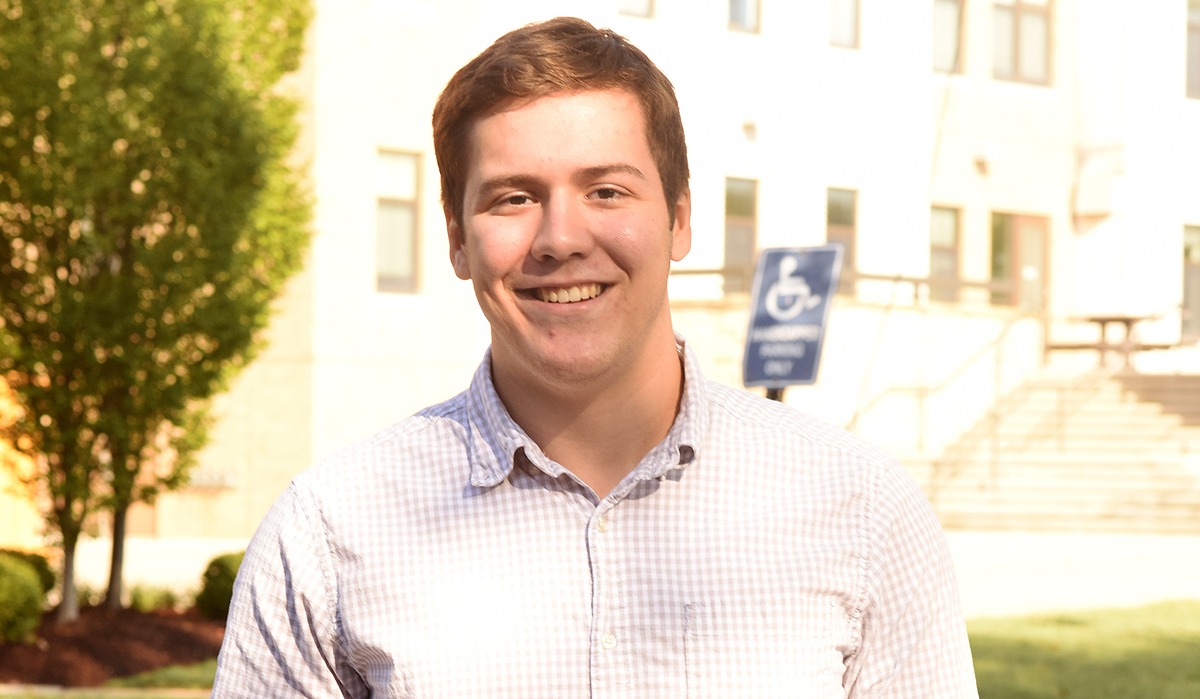 Andrew Carpenter smiling at the camera