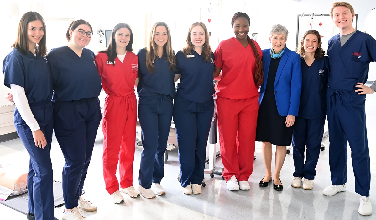 Dean Nolan (third from right) gathers with students