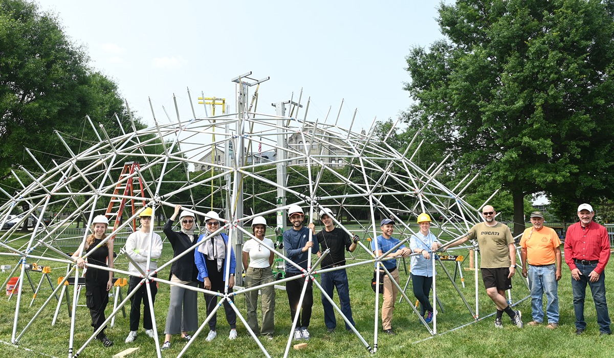 Students posing with their geodesic dome