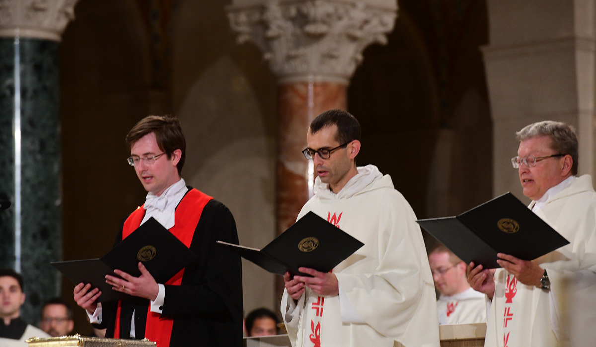 From left to right: Philosophy assistant professors Steven Waldorf and Father Bonaventure Chapman, O.P. and canon law assistant professor Msgr. William King profess their faith during the conferral of canonical mission. 