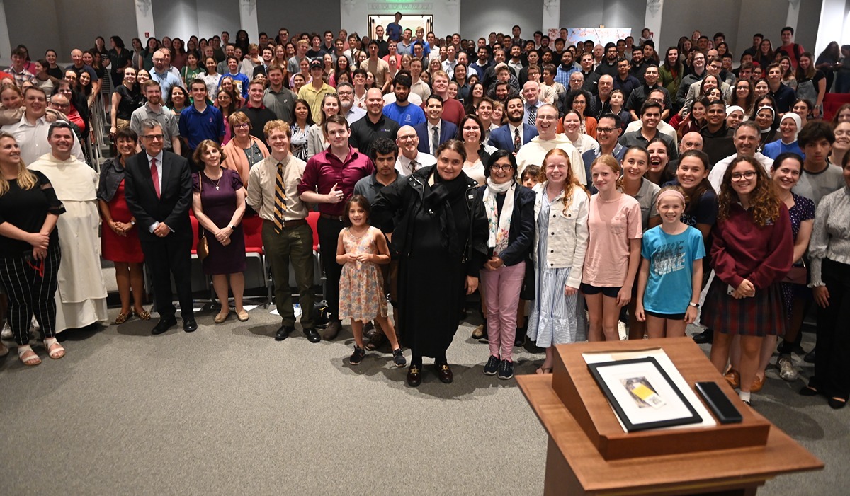 The packed audience gathers for a group photo