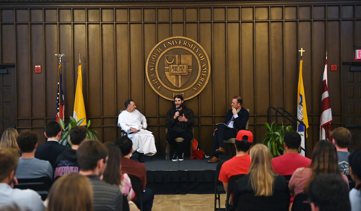 Nationals starting pitcher Trevor Williams (center) answered questions on stage with Athletic Director Kevin Robinson Jr. (right) and Father Aquinas Guilbeau, O.P. (left), the chaplain and director of Campus Ministry.)