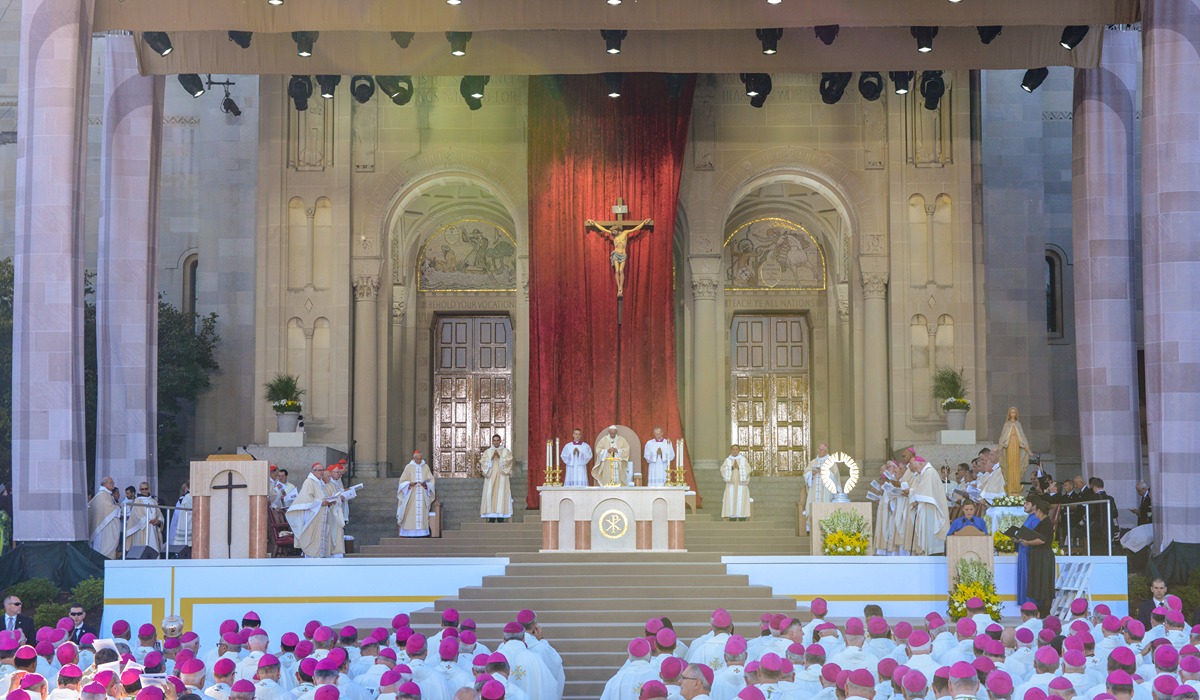 Pope francis speaking before a crowd 