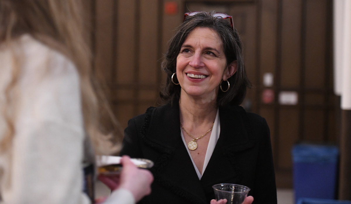 Helen Alvaré speaks to a student at the event 