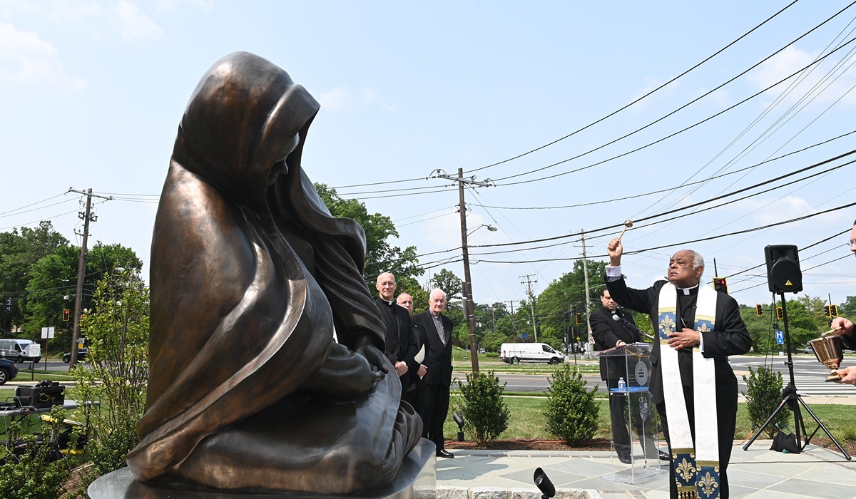 Cardinal Wilton Gregory, archbishop of Washington, blesses the sculpture “Advent” during its unveiling