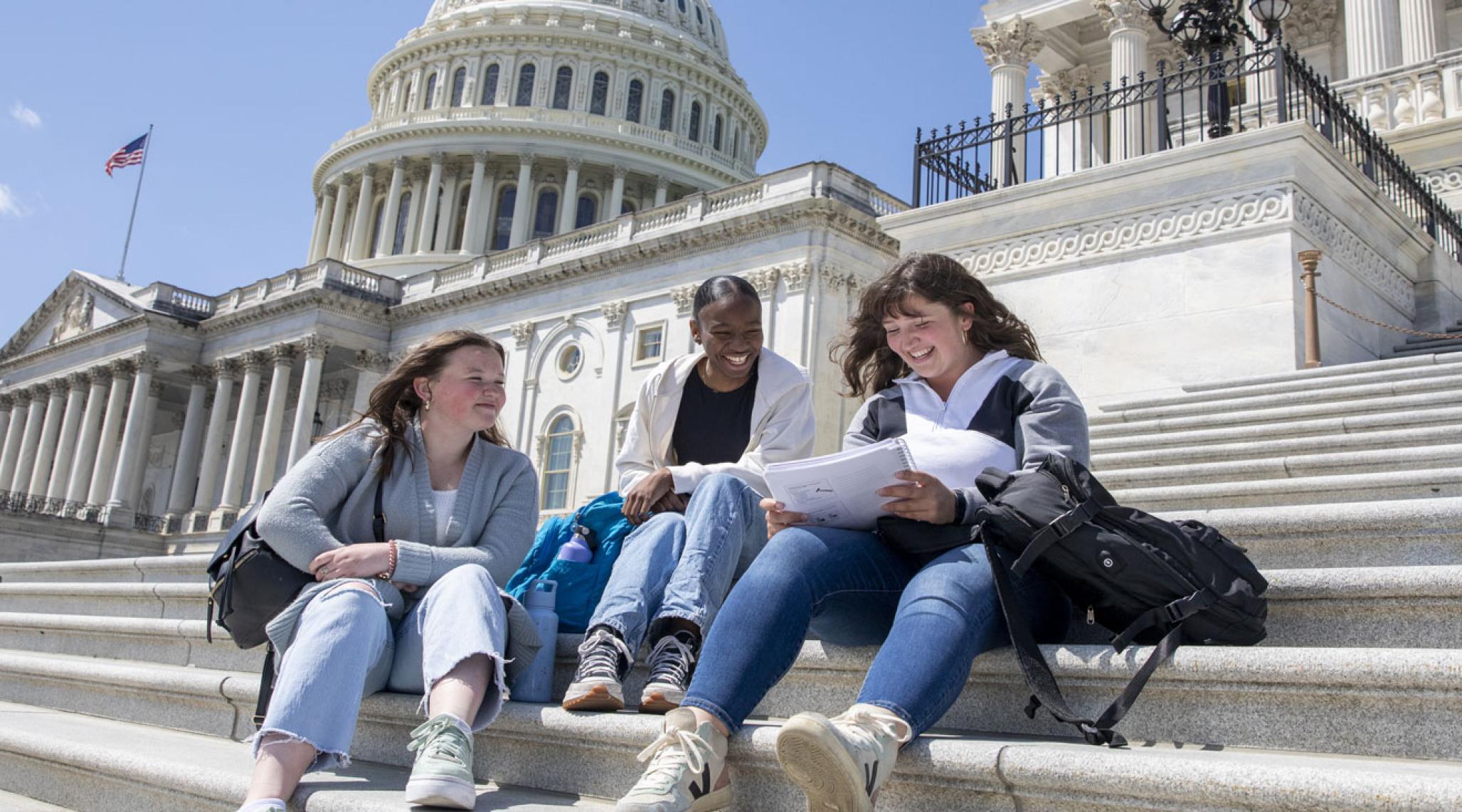 Students studying on the steps of the Capitol