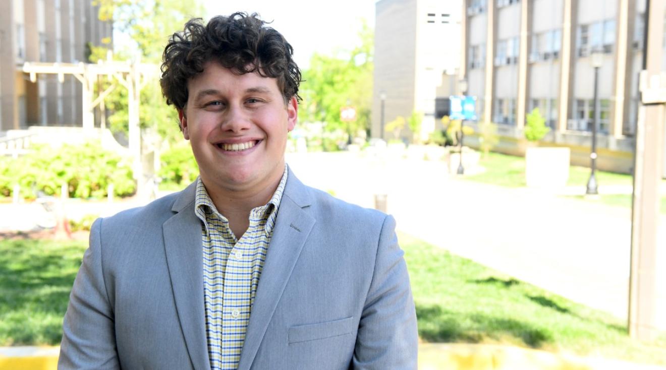 Elijah Feret standing on campus